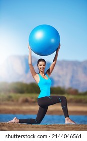 Reinvent Your Body. Shot Of A Young Woman Working Out With An Exercise Ball.