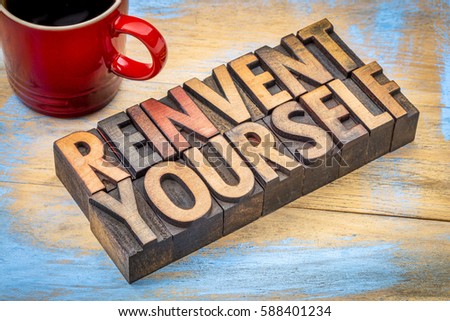 reinvent yourself - motivational words in vintage letterpress wood type against grunge, painted wood with a cup of coffee