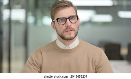 Rejecting Young Man Looking at Camera