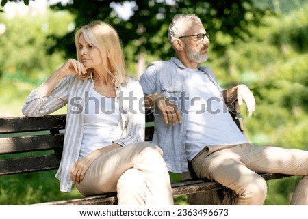 Relationship Crisis. Offended Mature Husband And Wife Sitting On Bench In Park After Argue, Senior Man And Woman Suffering Problems In Relations, Married Couple Angry After Quarrel, Copy Space