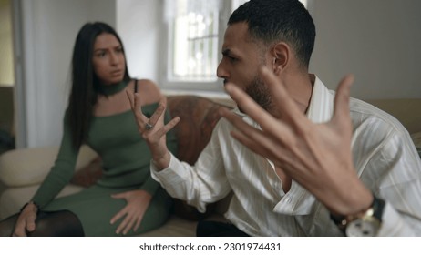 Relationship in crisis_ Young man and woman discussing and fighting with verbal altercation. Angry people yelling at each other - Powered by Shutterstock