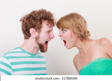 Relationship Difficulties. Angry Woman And Man Yelling At Each Other. Face To Face.