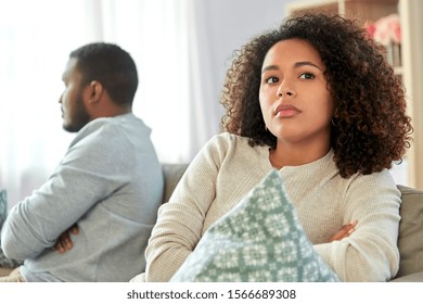 relationship difficulties, conflict and people concept - unhappy african american couple having argument at home - Shutterstock ID 1566689308