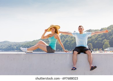 Relationship goals, outdoor relaxation, love and friendship concept. Man and woman sitting together outside hugging, having date. - Shutterstock ID 697688023