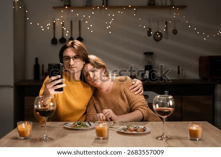 Relationship problem concept. Date. Unhappy woman bored on date while her boyfriend using mobile phone, Ignoring.