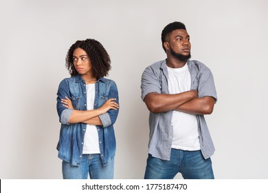 Relationship Problems. Offended African American Couple Ignoring Each Other After Argue, Standing With Folded Arms Over White Background, Copy Space