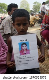 Relatives Hold Up Portraits Of Many Still Missing Collapse Of A Garment Factory Building, In Savar, Near Dhaka, Bangladesh, On May 3, 2013. On 24 April, An Eight-story Building Collapsed In Bangladesh