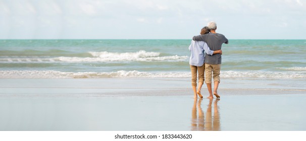 Relax  asian senior couple enjoy  on the  beach  with  blue  sky  background , Retirment  travel  holiday  healthy lifestyle  family Concept  , Banner for text - Powered by Shutterstock