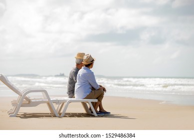 Relax  Asian Senior Couple  Sitting On Beach Chair Have Fun And Enjoy At The Beach, ,Retirement Lifestyle Healthy  Travel Vacation Concept