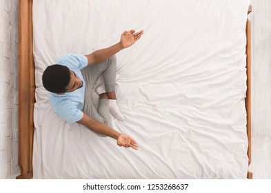 Relax And Breathe. Calm African-american Man Meditating In Bed Bed, Top View, Copy Space