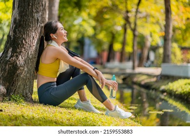 relax casual asian female sportwoman break time after finish morning run exercise healthy lifestyle ,asian female relax cooling down after run training under the tree near water in the park - Shutterstock ID 2159553883