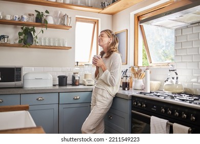 Relax, coffee and happy woman at home thinking about peaceful memories and enjoying her free time feeling content and relax. Mature lady at peace with positive mindset in her Australia house