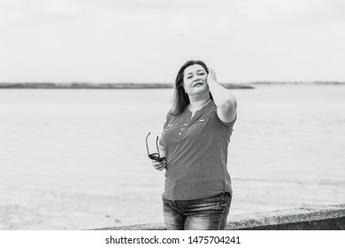 Relax concept. Plus size model, Woman rest at nature, attractive plump lady enjoy the life
