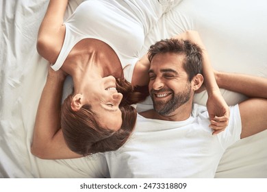 Relax, couple and smile of portrait on bed above view, peace or support for marriage commitment at house. Love, woman and man with embrace care, relationship romance or wake up together on holiday - Powered by Shutterstock