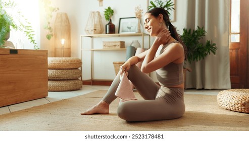 Relax, fitness and woman in home with towel, neck massage and yoga workout in living room. Pilates, wellness and girl on floor for muscle exercise, healthy morning routine and self care in apartment