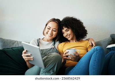 Relax, happy and a lesbian couple with a tablet on the sofa for social media, internet or a movie. Coffee, house and gay or lgbt women with technology for streaming a film or show on the couch - Powered by Shutterstock