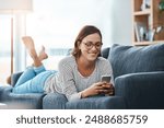 Relax, happy and woman on sofa with phone for text, funny group chat and social media at home. Female person, cell and smile on weekend for online dating profile, ecommerce or sale at shop in lounge