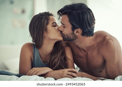 Relax, love and couple kiss in bed for intimacy, care and bonding together in home. Morning, woman and romantic man in bedroom for healthy relationship, connection and support with passion in house - Powered by Shutterstock