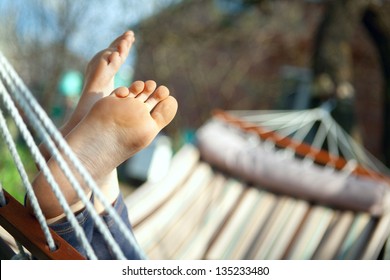 Relax In Nature. Feet Close Up In A Hammock