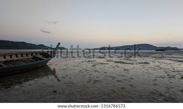 Relax on the beach in the evening, Palai Beach,\
Chalong District, Phuket,\
Thailand
