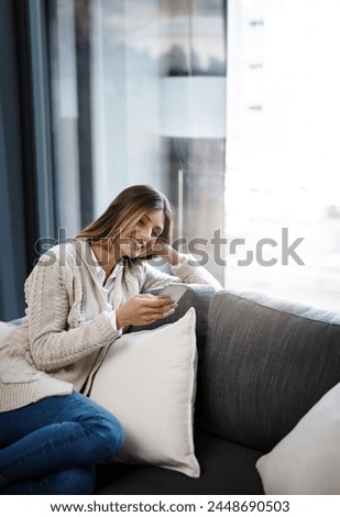 Relax, phone and girl on sofa laughing at funny meme, gif or social media, comic and reel at home. Smartphone, reading and female person in living room streaming video, movie watching blog in house