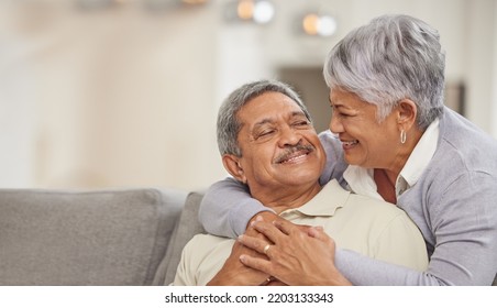 Relax, retirement and senior Mexico couple on sofa at home enjoying free time with smile, hug and love. Happy, comfortable and relationship of elderly man and woman on couch in living room together - Shutterstock ID 2203133343