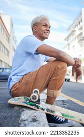 Relax, Skateboard And City Black Man In Street Of California In Summer With Gen Z Fashion. Edgy, Young And Trendy African American Skater Male In The USA Resting On Urban Road With Smile.