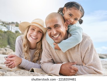 Relax, smile and travel with family at beach for summer, vacation and happy lifestyle together. Holiday, nature and diversity with portrait of man, woman and girl in sand for youth and happiness - Powered by Shutterstock