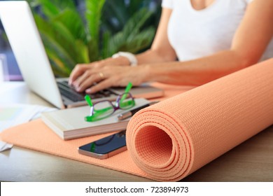 Relax at work concept. Yoga mat in an office desk