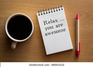 Relax, You Are Awesome - Reminder Or Positive Affirmation Words - Handwriting On A Notebook With Cup Of Coffee