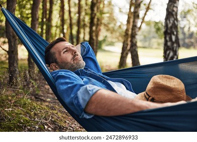 Relaxed adult man in hammock