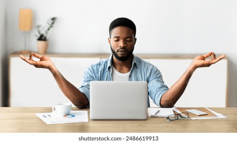 Relaxed african american businessman meditating in office, practicing yoga at workplace, making breathing exercise in zen position. Panorama with copy space - Powered by Shutterstock