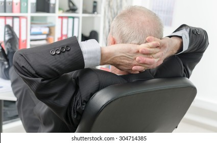 Relaxed businessman during a break at office