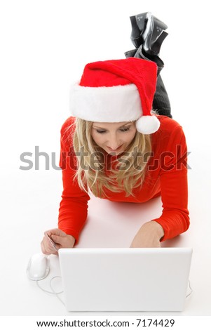 A relaxed female using a laptop, browsing and shopping online for gifts