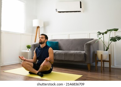 Relaxed Fit Man Doing A Meditation And Relaxing With The Cold Air Conditioning 