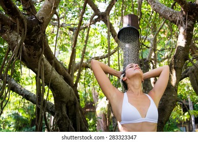 Relaxed Happy Woman Taking Spa Shower Outdoor In Exotic Garden.