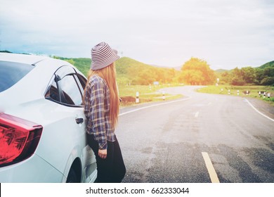 Relaxed Happy Woman Traveler On Summer Roadtrip Vacation On Hatchback Car