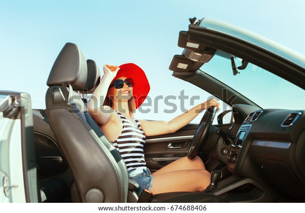 Relaxed happy woman
traveling in a car