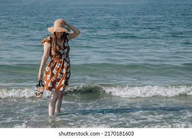 Relaxed Happy Woman Walking On The Beach