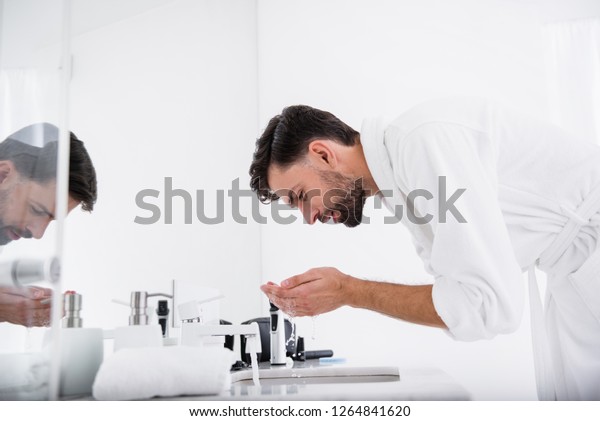 Relaxed Man Bathrobe Bending Over Sink Stock Photo Edit Now