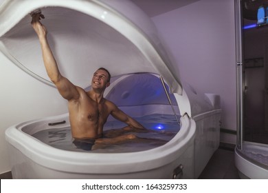 Relaxed Man Is Preparing For Floating In A Sensory Deprivation Tank. Welness And Spa Concept.