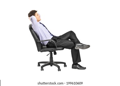 Relaxed Man Sitting In An Office Chair Isolated On White Background