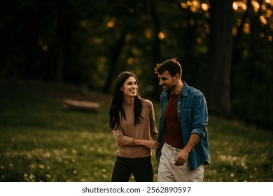 Relaxed man and woman enjoying a peaceful sunset walk surrounded by blooming flowers - Powered by Shutterstock