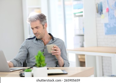 Relaxed Man Working Form Home On Laptop