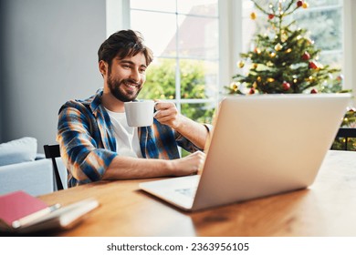 Relaxed man working at home during Christmas  - Powered by Shutterstock