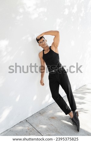 Similar – Strong Man Stretching Calf and Leaning on Wall