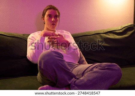 Relaxed Nighttime Snacking in Soft Colored Light