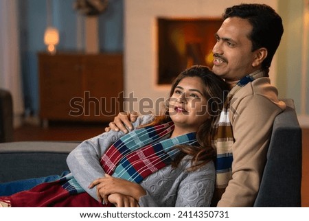 relaxed romantic loving couples spending time together in winter wear at home during weekend holidays - concept relationship bonding and intimacy.