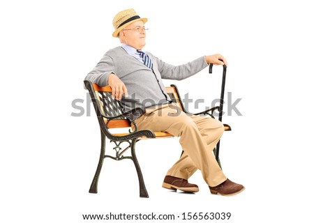 Relaxed senior man sitting on a wooden bench and thinking isolated on white background