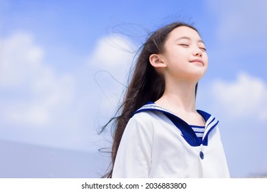  Relaxed Student Girl Enjoying Summer Breeze , Smiling With Eyes Closed